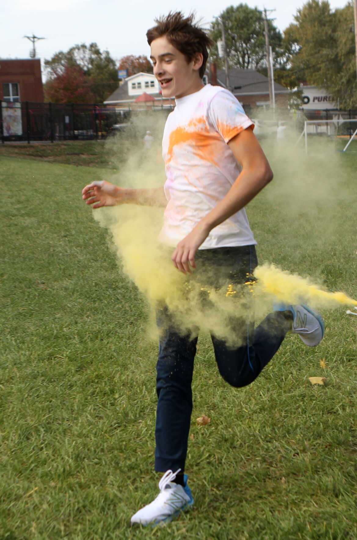 Andrew Dawson sprints through yellow powder